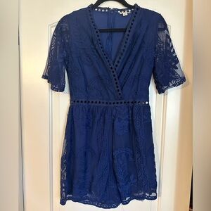 Francesca’s Navy Blue Floral Romper